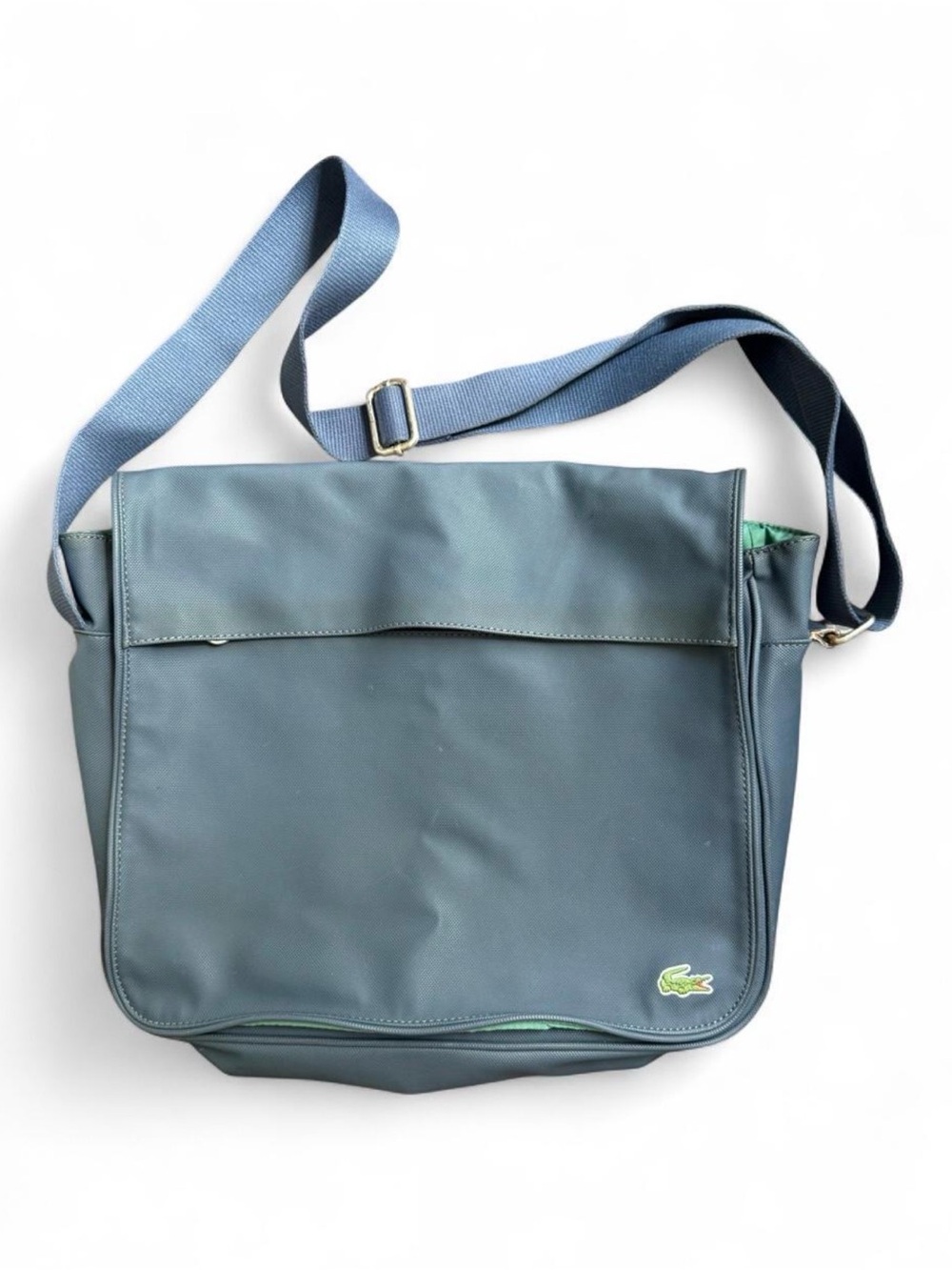 LACOSTE navy blue messenger bag. Looks gray in photos, it’s a navy coated canvas